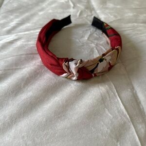 Red and Tan Padded Hair Accessory with Structured Design